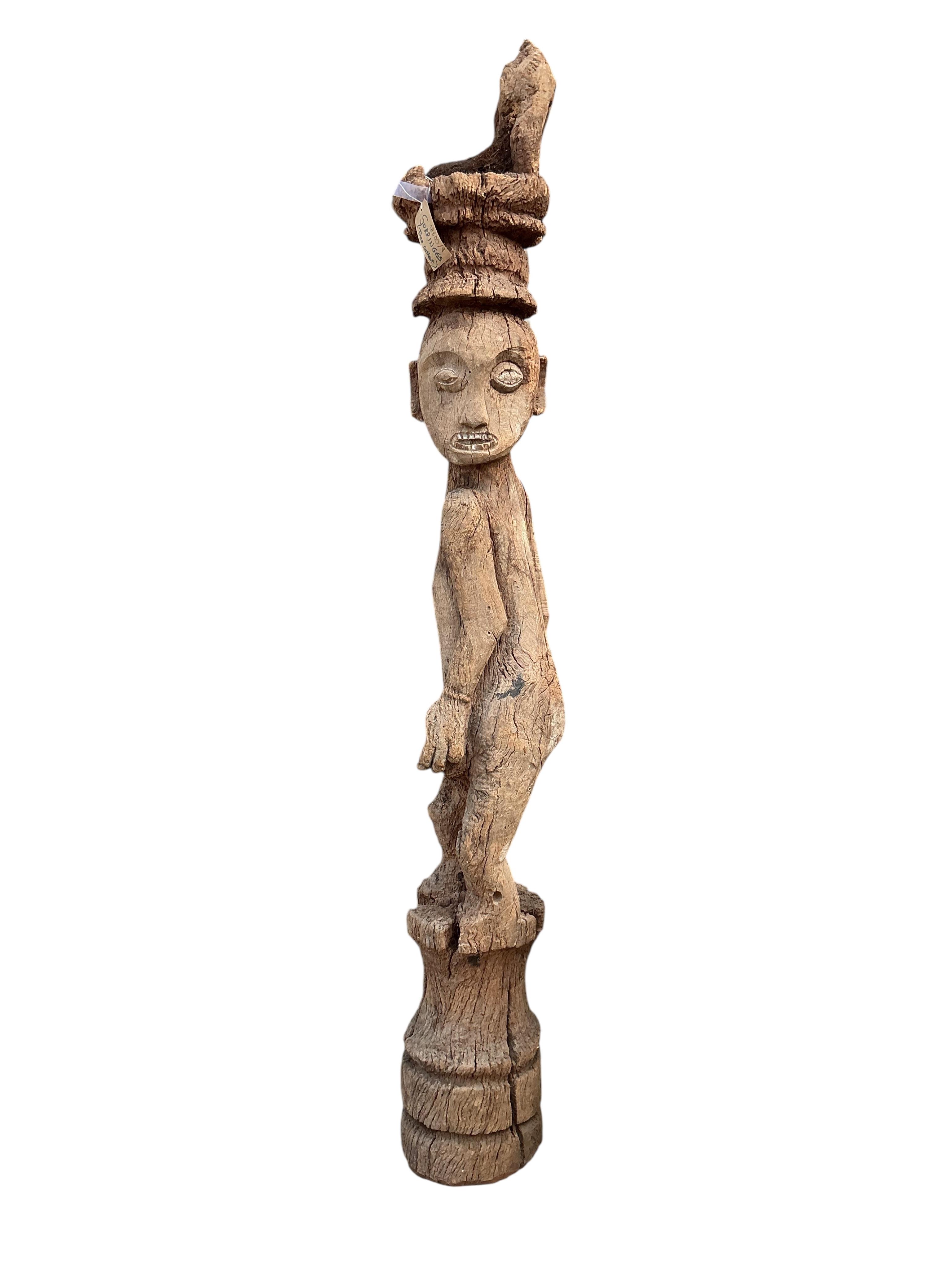 An Indonesian sculpture, height 210cm